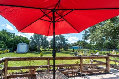 Absolutely Charming home nestled on a large fenced yard along a on Port Charlotte Golf Club in Florida - for sale on GolfHomes.com, golf home, golf lot