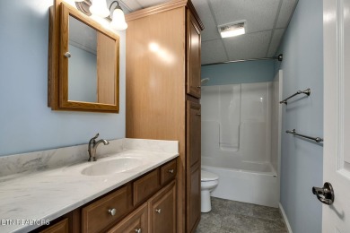 This very well maintained basement rancher features 4 bedrooms on Toqua Golf Course - Loudon County in Tennessee - for sale on GolfHomes.com, golf home, golf lot