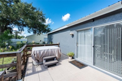Absolutely Charming home nestled on a large fenced yard along a on Port Charlotte Golf Club in Florida - for sale on GolfHomes.com, golf home, golf lot