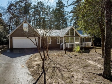 Beautiful home nestled in a private cove with abundance of trees on Holly Lake Ranch Golf Club in Texas - for sale on GolfHomes.com, golf home, golf lot