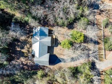 Beautiful home nestled in a private cove with abundance of trees on Holly Lake Ranch Golf Club in Texas - for sale on GolfHomes.com, golf home, golf lot