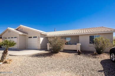 This inviting south-side home features an open concept living on London Bridge Golf Course in Arizona - for sale on GolfHomes.com, golf home, golf lot