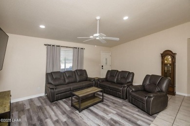 This inviting south-side home features an open concept living on London Bridge Golf Course in Arizona - for sale on GolfHomes.com, golf home, golf lot