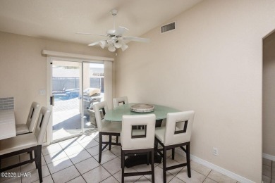 This inviting south-side home features an open concept living on London Bridge Golf Course in Arizona - for sale on GolfHomes.com, golf home, golf lot
