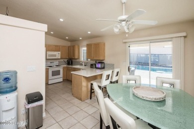 This inviting south-side home features an open concept living on London Bridge Golf Course in Arizona - for sale on GolfHomes.com, golf home, golf lot