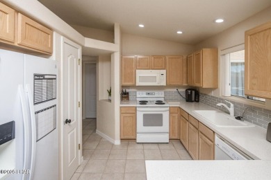 This inviting south-side home features an open concept living on London Bridge Golf Course in Arizona - for sale on GolfHomes.com, golf home, golf lot