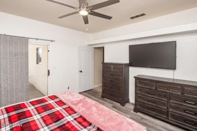 This inviting south-side home features an open concept living on London Bridge Golf Course in Arizona - for sale on GolfHomes.com, golf home, golf lot