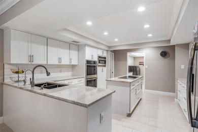 Discover this beautifully updated, move-in-ready pool home on East Lake Woodlands Country Club in Florida - for sale on GolfHomes.com, golf home, golf lot