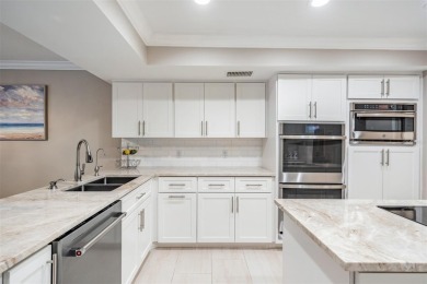 Discover this beautifully updated, move-in-ready pool home on East Lake Woodlands Country Club in Florida - for sale on GolfHomes.com, golf home, golf lot
