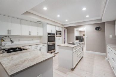 Discover this beautifully updated, move-in-ready pool home on East Lake Woodlands Country Club in Florida - for sale on GolfHomes.com, golf home, golf lot
