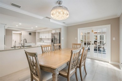 Discover this beautifully updated, move-in-ready pool home on East Lake Woodlands Country Club in Florida - for sale on GolfHomes.com, golf home, golf lot