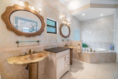 Discover this beautifully updated, move-in-ready pool home on East Lake Woodlands Country Club in Florida - for sale on GolfHomes.com, golf home, golf lot