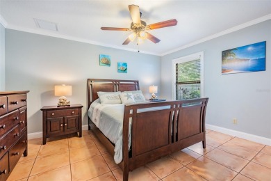 Discover this beautifully updated, move-in-ready pool home on East Lake Woodlands Country Club in Florida - for sale on GolfHomes.com, golf home, golf lot