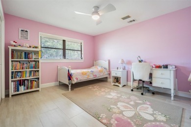 Discover this beautifully updated, move-in-ready pool home on East Lake Woodlands Country Club in Florida - for sale on GolfHomes.com, golf home, golf lot