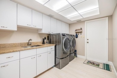 Discover this beautifully updated, move-in-ready pool home on East Lake Woodlands Country Club in Florida - for sale on GolfHomes.com, golf home, golf lot