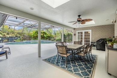 Discover this beautifully updated, move-in-ready pool home on East Lake Woodlands Country Club in Florida - for sale on GolfHomes.com, golf home, golf lot