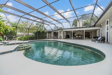 Discover this beautifully updated, move-in-ready pool home on East Lake Woodlands Country Club in Florida - for sale on GolfHomes.com, golf home, golf lot