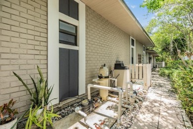 Discover this beautifully updated, move-in-ready pool home on East Lake Woodlands Country Club in Florida - for sale on GolfHomes.com, golf home, golf lot