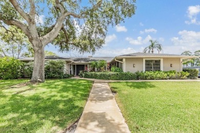 Discover this beautifully updated, move-in-ready pool home on East Lake Woodlands Country Club in Florida - for sale on GolfHomes.com, golf home, golf lot