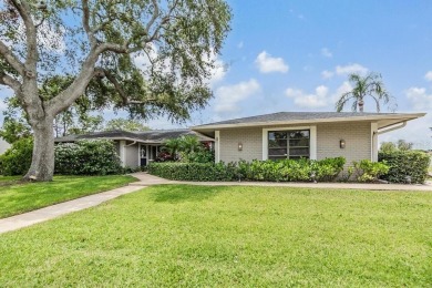 Discover this beautifully updated, move-in-ready pool home on East Lake Woodlands Country Club in Florida - for sale on GolfHomes.com, golf home, golf lot