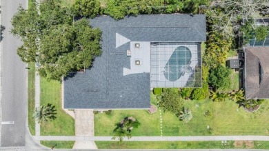 Discover this beautifully updated, move-in-ready pool home on East Lake Woodlands Country Club in Florida - for sale on GolfHomes.com, golf home, golf lot