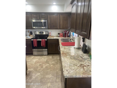 This home has been updated with a new heat pump AC conditioner on London Bridge Golf Course in Arizona - for sale on GolfHomes.com, golf home, golf lot