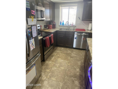 This home has been updated with a new heat pump AC conditioner on London Bridge Golf Course in Arizona - for sale on GolfHomes.com, golf home, golf lot