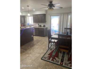 This home has been updated with a new heat pump AC conditioner on London Bridge Golf Course in Arizona - for sale on GolfHomes.com, golf home, golf lot