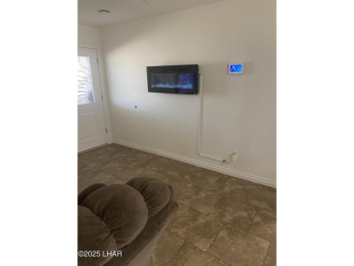 This home has been updated with a new heat pump AC conditioner on London Bridge Golf Course in Arizona - for sale on GolfHomes.com, golf home, golf lot