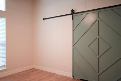 Completely remodeled and packed with charm, this 2 bed, 1.5 bath on Bella Vista Country Club - Berksdale in Arkansas - for sale on GolfHomes.com, golf home, golf lot
