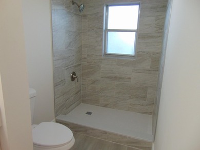 WELCOME TO THIS SPARKLING CONDO THAT HAS BEEN UPDATED on Poinciana Golf Club in Florida - for sale on GolfHomes.com, golf home, golf lot