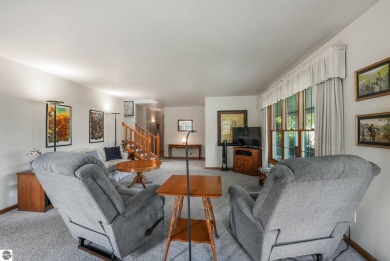 Located just blocks from Lake Michigan and adjacent to Manistee on Manistee Golf and Country Club in Michigan - for sale on GolfHomes.com, golf home, golf lot