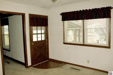 Solid 3BR/2BA ranch home ideally located directly across from on Murray Golf Course, Inc in Kentucky - for sale on GolfHomes.com, golf home, golf lot