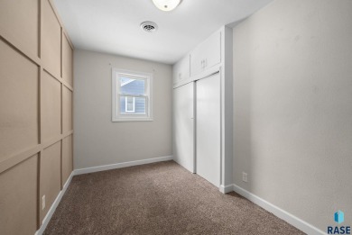 Cute as a button! This quaint one-level home is sure to impress on Elmwood Park Golf Course in South Dakota - for sale on GolfHomes.com, golf home, golf lot