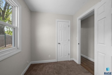 Cute as a button! This quaint one-level home is sure to impress on Elmwood Park Golf Course in South Dakota - for sale on GolfHomes.com, golf home, golf lot