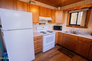 Meticulously maintained and beautifully updated chalet in the on The Hideout Golf in Pennsylvania - for sale on GolfHomes.com, golf home, golf lot