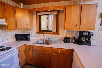 Meticulously maintained and beautifully updated chalet in the on The Hideout Golf in Pennsylvania - for sale on GolfHomes.com, golf home, golf lot