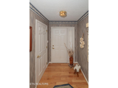 Beautiful home nestled among mature trees giving just enough on Emory Golf and Country Club in Tennessee - for sale on GolfHomes.com, golf home, golf lot