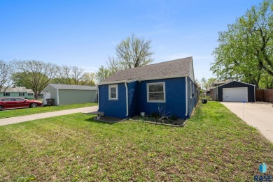 Cute as a button! This quaint one-level home is sure to impress on Elmwood Park Golf Course in South Dakota - for sale on GolfHomes.com, golf home, golf lot