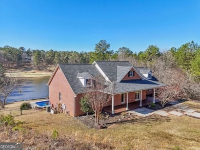 Experience luxury and convenience in this stunning lakefront on Canongate At Healy Point Country Club in Georgia - for sale on GolfHomes.com, golf home, golf lot