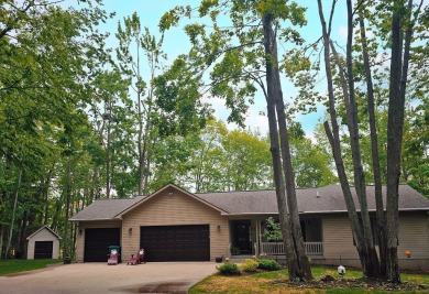 Step into this immaculate custom home, perfectly situated with on Michaywe Pines Course in Michigan - for sale on GolfHomes.com, golf home, golf lot