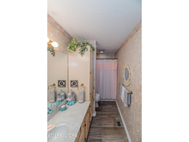 Beautiful home nestled among mature trees giving just enough on Emory Golf and Country Club in Tennessee - for sale on GolfHomes.com, golf home, golf lot