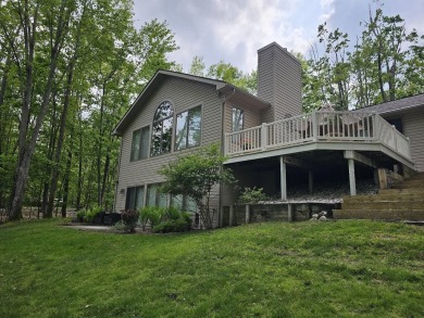 Step into this immaculate custom home, perfectly situated with on Michaywe Pines Course in Michigan - for sale on GolfHomes.com, golf home, golf lot
