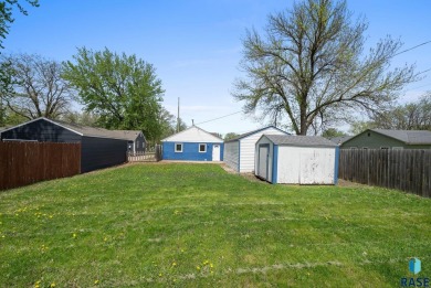 Cute as a button! This quaint one-level home is sure to impress on Elmwood Park Golf Course in South Dakota - for sale on GolfHomes.com, golf home, golf lot