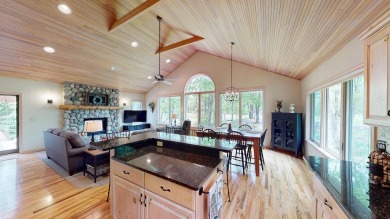 Step into this immaculate custom home, perfectly situated with on Michaywe Pines Course in Michigan - for sale on GolfHomes.com, golf home, golf lot