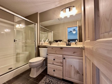 Step into this immaculate custom home, perfectly situated with on Michaywe Pines Course in Michigan - for sale on GolfHomes.com, golf home, golf lot