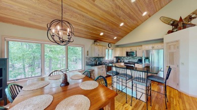 Step into this immaculate custom home, perfectly situated with on Michaywe Pines Course in Michigan - for sale on GolfHomes.com, golf home, golf lot