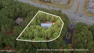 Situated on a corner lot and nestled on 1.29 wooded acres in the on The Neuse Golf Club in North Carolina - for sale on GolfHomes.com, golf home, golf lot