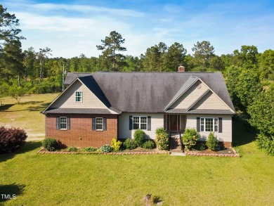 Welcome to your own 3-bedroom, 2-bath country retreat, perfectly on Carolina Lakes Country Club in North Carolina - for sale on GolfHomes.com, golf home, golf lot
