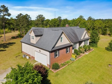 Welcome to your own 3-bedroom, 2-bath country retreat, perfectly on Carolina Lakes Country Club in North Carolina - for sale on GolfHomes.com, golf home, golf lot